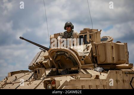 Soldiers from 3rd Armored Brigade Combat Team, 1st Cavalry Division position their Bradley Fighting Vehicle during a defensive attack training exercise at Fort Hood Texas, July 9, 2021. Stock Photo