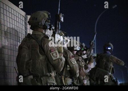 Norwegian Soldiers from Task Force Vikings conduct a transfer of ...