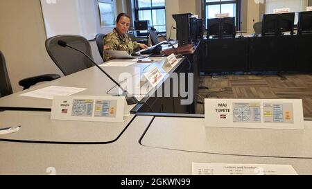 WHINSEC’s School of Professional Military Education (SPME) gets ready for the start of CGSOC, class 2022.     FORT BENNING, GA – US Army Command and General Staff Officer Course (CGSOC) Instructor Maj. Martha A. Plumley goes through the pre-operations checks in her classroom at the Institute today. Stock Photo