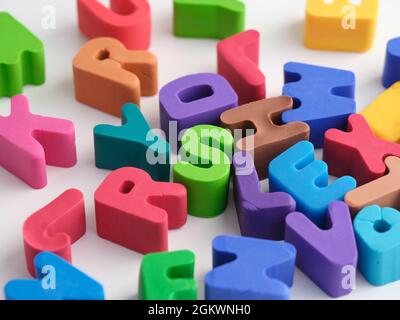 Play clay letters scattered on a table. Close up. Stock Photo