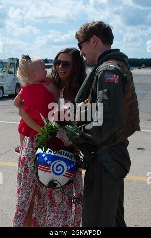 VIRGINIA BEACH, Va. (July 12, 2021) Families welcome home Sailors assigned to the “Screwtops” of Airborne Command and Control Squadron (VAW) 123 on Naval Air Station (NAS) Oceana during the squadron’s homecoming. VAW-123, part of Carrier Air Wing 3 embarked on USS Dwight D. Eisenhower (CVN 69), returns to NAS Oceana after a regularly scheduled deployment in support of maritime security operations and theater security cooperation efforts in U.S. 5th and 6th Fleet. Stock Photo