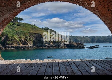 Saints Bay Harbour, a beautiful beach cove surrounded by jagged rocky cliffs Stock Photo