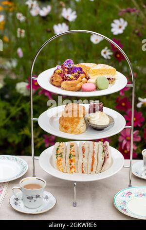 Afternoon tea with cakes, scones and sandwiches Stock Photo