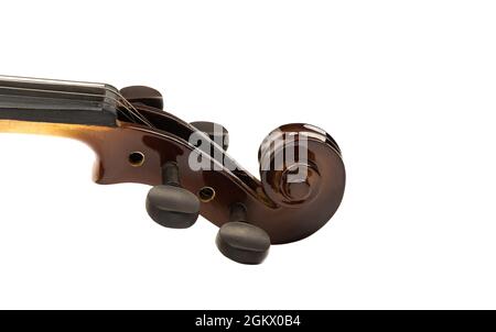 Side view of the scroll and pegs of a violin on a white background. Close up. Copy space. Stock Photo