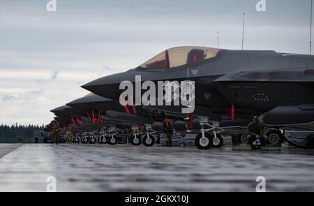 Twenty F-35A Lightning II aircraft assigned to the 354th Fighter Wing (FW) wait to be refueled during an Agile Combat Employment exercise on Eielson Air Force Base, Alaska, July 14, 2021. The 354th FW conducted a local exercise from a simulated austere location to test its ability to generate airpower quickly, efficiently and repeatedly. Stock Photo