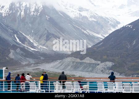 Tourists on the deck of a cruise ship view scenery along the Tarr Inlet in Glacier Bay National Park, Alaska Stock Photo