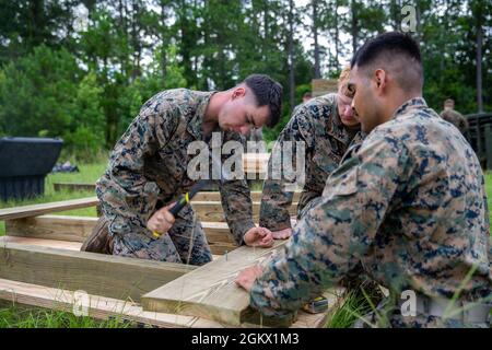 U.S. Marines with Bravo Company, 8th Engineer Support Battalion, 2nd Marine Logistics Group, build a combat operations center during a field exercise on July 14, 2021 at Camp Lejeune, North Carolina. The Marines built an underground COC to hide from a simulated enemy in a contested environment. Stock Photo