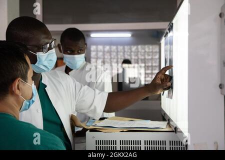 Senegalese orthopedic Dr. Madior Diouf discusses a patients treatment ...