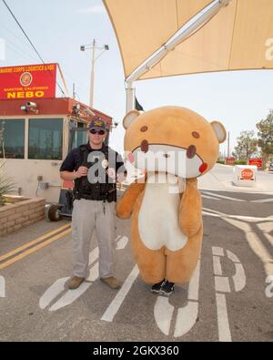 https://l450v.alamy.com/450v/2gkx360/bearsun-is-escorted-through-marine-corps-logistics-base-barstow-as-part-of-his-journey-from-los-angeles-to-new-york-in-a-bear-costume-to-raise-awareness-for-various-charities-july-14-this-part-of-historic-route-66-is-the-only-portion-not-accessible-to-the-public-without-special-permission-by-the-base-commanding-officer-col-gregory-pace-colonel-pace-approved-the-request-and-the-marine-corps-police-department-provided-the-escort-he-stopped-several-times-in-102-degree-heat-to-graciously-take-photos-with-base-fans-jesse-larios-started-out-his-journey-as-iambearsun-to-raise-awareness-for-2gkx360.jpg