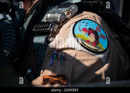 A patch sits on the shoulder of Nate Vogel, a 586th Flight Test Squadron pilot, during the Global Information Dominance Experiment 3, and Architecture Demonstration and Evaluation 5, at Alpena Combat Training Center, Alpena, Michigan, July 16, 2021. The North American Aerospace Defense Command and U.S. Northern Command, NORAD and USNORTHCOM, in partnership with all 11 Combatant Commands, led the third in a series of Global Information Dominance Experiments designed to rapidly develop the capabilities required to increase deterrence options in competition and crisis through a data-centric softw Stock Photo