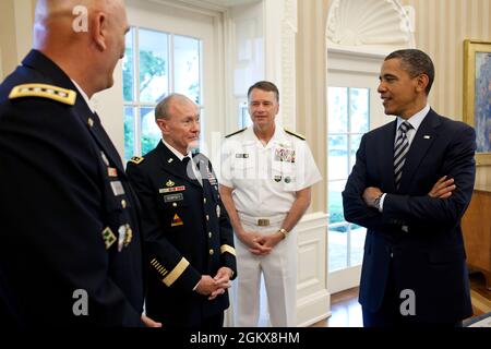 President Barack Obama talks with, from left, Gen. Ray Odierno, Gen. Martin Dempsey, and Admiral James 'Sandy' Winnefeld in the Oval Office, May 29, 2011. The President later nominated Gen. Dempsey to be the Chairman of the Joint Chiefs, Admiral Winnefeld to be Vice Chairman of the Joint Chiefs, and Gen. Odierno to be Army Chief of Staff. (Official White House Photo by Pete Souza) This official White House photograph is being made available only for publication by news organizations and/or for personal use printing by the subject(s) of the photograph. The photograph may not be manipulated in a Stock Photo