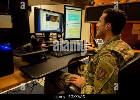 U.S. Air Force Airman 1st Class Trent Due, 1st Air and Space Communications Operations Squadron collateral systems administrator, demonstrates operating and maintaining the Global Command and Control System (GCCS) at the 1st ACOS GCCS Work Center at Ramstein Air Base, Germany, July 16, 2021. The 1st ACOS uses mechanisms such as the GCCS to monitor, transmit, and communicate missile defense data. Stock Photo