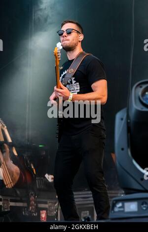 Bassist with The Dualers band performing at a music concert festival in Garon Park, Southend on Sea, Essex, UK. Bass player Stock Photo