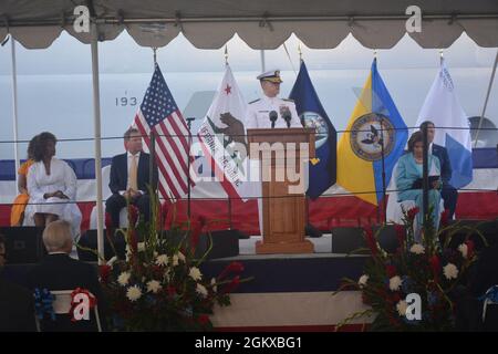 Rear Adm. Michael Wettlaufer, Commander, Military Sealift Command, speaks during the christening ceremony of the fleet replenishment oiler USNS John Lewis.  Wettlaufer was one of several speakers at the event that also included House Speaker Nancy Pelosi (right) and actress and activist Alfre Woodard Spenser (left). Stock Photo