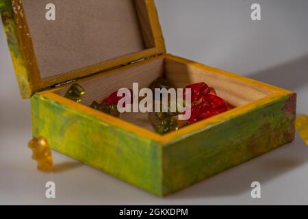 Color wooden box with cap on white background with nice reflection and color fresh candy Stock Photo