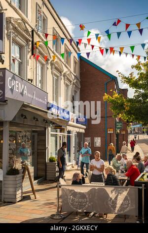 UK, England, Cheshire, Congleton, Bridge Street, Crema deli and café, al-fresco customers in pedestrianized shopping street Stock Photo