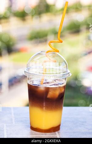 Bumble coffee - refreshment summer iced cocktail with espresso, orange juice, caramel syrup and ice Stock Photo