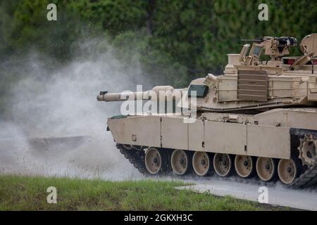 A U.S. Army M1A2 SEP V2 Abrams Tank, assigned to 3rd Squadron, 16th Calvary Regiment, fires the 120mm main gun at their assigned targets at Ware Range, Fort Benning, GA., July 20, 2021. These Tankers are training to become Mater Gunners, and be subject matter experts in their field. Stock Photo