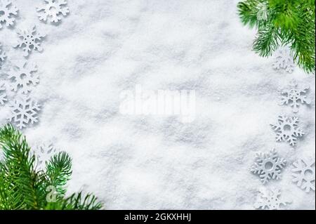 Fir branch with big snowflakes on white background. Holiday concept. Stock Photo