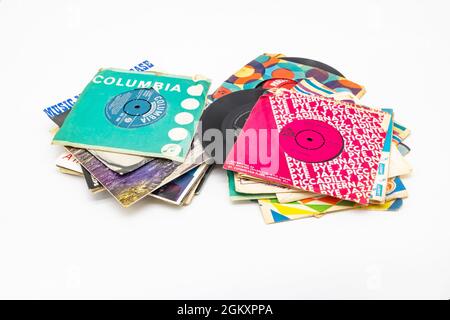 assorted seven inch single vinyl 45rpm records in colourful paper sleeves Stock Photo