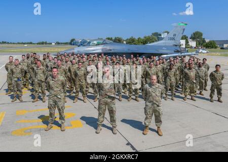 U.S. Air Force members assigned to the 555th Aircraft Maintenance Unit pose for a photo during exercise Thracian Star 21 at Graf Ignatievo Air Base, Bulgaria, July 21, 2021. More than 150 Airmen and eight F-16 Fighting Falcons assigned to the 555th Fighter Squadron participated in Thracian Star 21, a Bulgarian air force-led exercise aiming to enhance interoperability and the ability to rapidly deploy to remote locations, July 9-22, 2021. Stock Photo