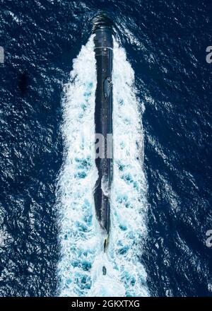 SAN CLEMENTE ISLAND, Calif. (July 20, 2021) The Los Angeles class nuclear-powered attack submarine USS Alexandria (SSN 757) transits the Pacific Ocean during Summer Fury 21 Advanced Naval Basing. Summer Fury is an exercise conducted by 3rd Marine Aircraft Wing (MAW) in order to maintain and build capability, strength and trust within its units to generate the readiness and lethality needed to deter and defeat adversaries during combat operations as the U.S. Marine Corps refines tactics and equipment in accordance with Force Design 2030. Stock Photo