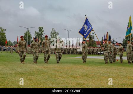 Maj. Gen. Brian Eifler, Commanding General USARAK (Incoming), left, Maj. Gen. Xavier Brunson, Commander I Corps, center, Maj. Gen. Peter Andrysiak, Commanding General USARAK (Outgoing), right, conduct a review of troops during the Change of Command ceremony on Pershing Field at Joint Base Elmendorf-Richardson July 21. Stock Photo