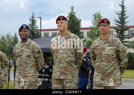 Maj. Gen. Xavier Brunson, Commander I Corps, left, Maj. Gen. Peter Andrysiak, Commanding General USARAK (Outgoing), center, Maj. Gen. Brian Eifler, Commanding General USARAK (Incoming), right wait for the start of the Change of Command held at Pershing Field on Joint Base Elmendorf-Richardson July 21. Stock Photo