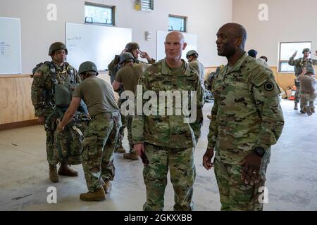 Col. Michael “Jody” Shouse (left), commander of the 4th Infantry Brigade Combat Team (Airborne), 25th Infantry Division, US Army Alaska, discusses Arctic Strategy  with Maj. Gen. Xavier T. Brunson, commander of I Corps, Washington, about the challenges of working in an Arctic environment as they observe a class of future jumpmasters at Joint Base Elmendorf-Richardson, July 22, 2021. The 4th IBCT (ABN), 25th ID is the US Army’s only Arctic airborne brigade and is the leading edge of the developing Arctic strategy. Stock Photo