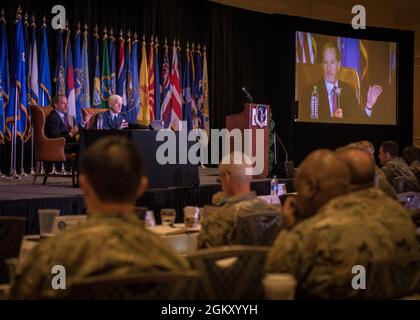 Retired U.S. Air Force Gen. David L. Goldfein, left, former Chief of Staff of the U.S. Air Force, and retired Lt. Gen. L. Scott Rice, right, former director, Air National Guard, speak during a leadership panel at the 2021 Air National Guard Senior Leader Conference (ASLC) in St. Louis, Missouri, July 22, 2021. ASLC 21 joins together senior leaders and commanders from across the 90 wings to exchange ideas and provide input on critical matters that impact the future of the enterprise. Stock Photo