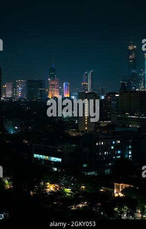 JAKARTA, INDONESIA - Jul 07, 2021: A skyline of Jakarta Indonesia at night with view on impressive skyscrapers and neon lights Stock Photo