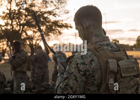 A U.S. Marine with Charley Company, 1st Battalion, 7th Marine Regiment, Marine Rotational Force Darwin 21.2, conducts radio checks prior to Operation Sea Raider during Talisman Sabre 2021 in Townsville, Queensland, Australia, July 23, 2021. TS21 supports the U.S. National Defense Strategy by enhancing the ability to protect the homeland and provide combat-credible forces to address the full range of potential security concerns in the Indo-Pacific.