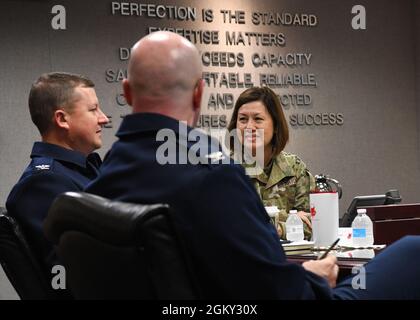 Chief Master Sgt. of the Air Force JoAnne S. Bass receives a mission briefing from 89th Airlift Wing Airmen during a wing visit at Joint Base Andrews, M.D., July 23, 2021. Bass learned more about the 89th AW, which provides global Special Air Mission airlift, logistics, aerial port and communications for the president, vice president, cabinet members, combatant commanders and other senior military and elected leaders as tasked by the White House, Air Force chief of staff and Air Mobility Command. Stock Photo