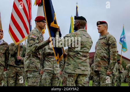 Maj. Gen. Xavier Brunson, Commander I Corps, center, passes Maj. Gen. Brian Eifler, Commanding General USARAK (Incoming), left, the US Army Alaska colors for his assumption of command of USARAK while Maj. Gen. Peter Andrysiak, Commanding General USARAK (Outgoing), right, watches during the Change of Command ceremony on Pershing Field at Joint Base Elmendorf-Richardson July 21. Stock Photo