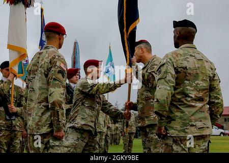 Command Sgt. Maj. Philip B. Blaisdell, center left, passes Maj. Gen. Peter Andrysiak, Commanding General USARAK (Outgoing), center right, the US Army Alaska colors for the last time while Maj. Gen. Xavier Brunson, Commander I Corps, right, and Maj. Gen. Brian Eifler, Commanding General USARAK (Incoming), left, watch during the Change of Command ceremony on Pershing Field at Joint Base Elmendorf-Richardson July 21. Stock Photo