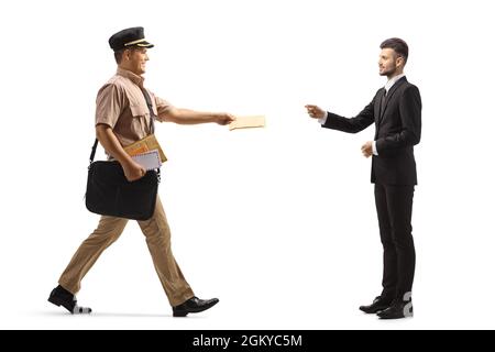 Full length profile shot of a mailman delivering a letter to a businessman isolated on white background Stock Photo