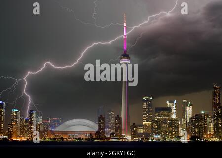 Toronto, Canada-January 7, 2020: Urban skyline and the CN Tower during the night. This area is a major tourist attraction in the country Stock Photo