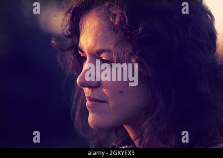 Portrait photo of pensive young woman Stock Photo