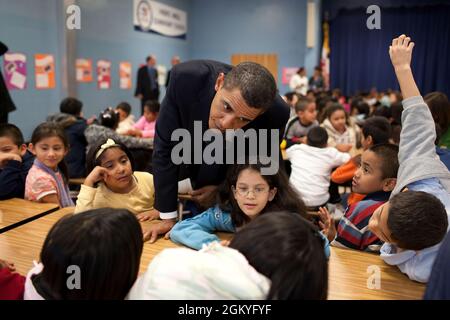 President Barack Obama talks with third and fourth grade students during a surprise visit to Viers Mill Elementary School, in Silver Spring, Md., Oct. 19, 2009. (Official White House Photo by Pete Souza) This official White House photograph is being made available only for publication by news organizations and/or for personal use printing by the subject(s) of the photograph. The photograph may not be manipulated in any way and may not be used in commercial or political materials, advertisements, emails, products, promotions that in any way suggests approval or endorsement of the President, the Stock Photo