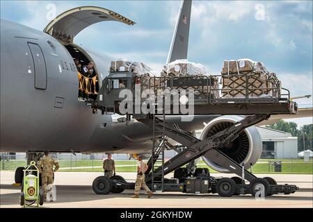 Airmen from the 127th Logistics Readiness Squadron use a cargo loader called a K Loader to load cargo unto a KC 46A Pegasus at Selfridge Air National Guard Base Michigan on July 30