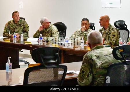 Col. James Brady, commander, U.S. Garrison Fort Bliss, provides and update to Lt. Gen. Antonio A. Aguto Jr., commanding general, First Army, and Command Sgt. Maj. John P. McDwyer, command sergeant major, First Army, during a meeting at Fort Bliss, Texas, July 30, 2021. During the visit, Aguto and McDwyer were provided an initial orientation of the Fort Bliss Mobilization Force Generation Installation (MFGI) in support of U.S. Army Reserve and National Guard units and visited the Dona Ana Range Complex, New Mexico. Stock Photo