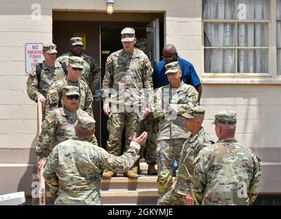 Command Sgt. Maj. Gerado Gonzalez, command sergeant major, U.S. Garrison Fort Bliss, provides and update to Lt. Gen. Antonio A. Aguto Jr., commanding general, First Army, following a tour of the Mobilization Division, Directorate of Plans, Training, Mobilization & Security (DPTMS housing area at Fort Bliss, Texas, on July 30, 2021. During the visit, Aguto received an initial orientation of the Fort Bliss Mobilization Force Generation Installation (MFGI) in support of U.S. Army Reserve and National Guard units and visited the Dona Ana Range Complex, New Mexico. Stock Photo