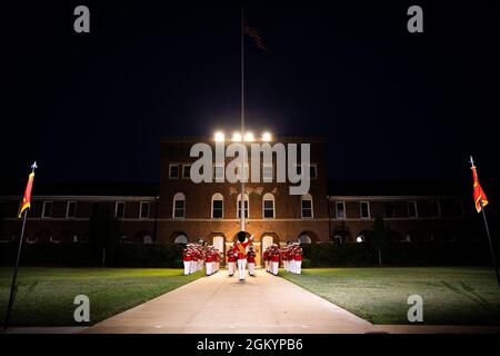 “The President’s Own,” U.S. Marine Band, performs during the Friday Evening Parade at Marine Barracks Washington, July 30, 2021. The guest of honor for the evening was The Honorable Kathleen H. Hicks, 35th Deputy Secretary of Defense, and the hosting official was Gen. David H. Berger, 38th Commandant of the Marine Corps. Stock Photo