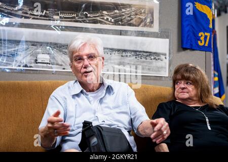 Thomas Coons (left), senior master sergeant, retired, and his wife Sandi, meet with MTIs with the 737th Training Squadron during a visit, Aug. 30, 2021, at Joint Base San Antonio-Lackland, Texas. Coons joined the U.S. Air Force in 1965 and retired in 1989. He decided it was time to donate his uniform to the Airman Heritage Museum but not without putting it on one last time. Stock Photo