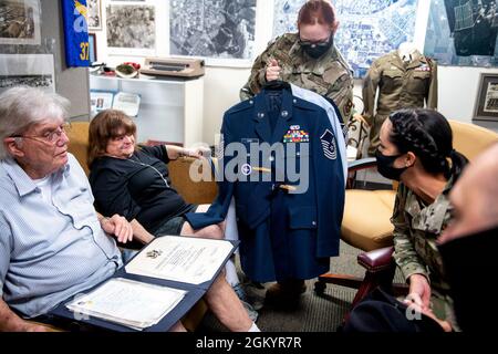 Thomas Coons (left), senior master sergeant, retired, and his wife Sandi, meet with Staff Sgt. Kendall Steffen (center), 737th Training Squadron accounting technician, and MTIs with the 737th TRS during a visit, Aug. 30, 2021, at Joint Base San Antonio-Lackland, Texas. Coons joined the U.S. Air Force in 1965 and retired in 1989. He decided it was time to donate his uniform to the Airman Heritage Museum but not without putting it on one last time. Stock Photo