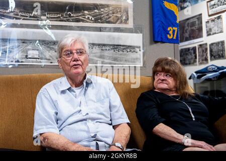 Thomas Coons (left), senior master sergeant, retired, and his wife Sandi, meet with MTIs with the 737th Training Squadron during a visit, Aug. 30, 2021, at Joint Base San Antonio-Lackland, Texas. Coons joined the U.S. Air Force in 1965 and retired in 1989. He decided it was time to donate his uniform to the Airman Heritage Museum but not without putting it on one last time. Stock Photo