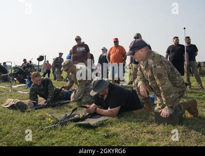 Members of the U.S. Air Force High Power Rifle Team, instruct students in the Small Arms Firing School at Camp Perry, Ohio, July 31, 2021. The U.S. Air Force High Power Rifle Team is formed from total force Airmen who compete in the National Matches and train others the principles of marksmanship. Stock Photo