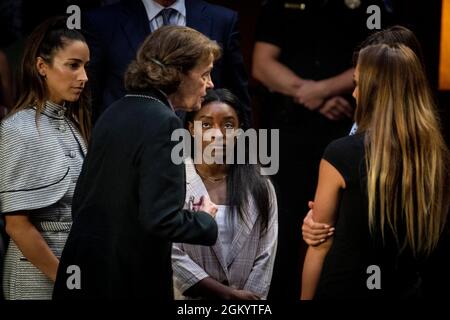 United States Senator Dianne Feinstein (Democrat of California), second from left, talks with former U.S. Olympic gymnast Aly Raisman, left, US Olympic gymnast Simone Biles, second from right, and NCAA and world champion gymnast Maggie Nichols, right, following a Senate Committee on the Judiciary hearing to examine the Inspector General's report on the Federal Bureau of Investigation's handling of the Larry Nassar investigation in the Hart Senate Office Building in Washington, DC, Wednesday, September 15, 2021. Credit: Rod Lamkey/CNP Stock Photo