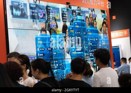 CHONGQING, CHINA - Aug 28, 2019: A public screen displaying personal information with facial recognition technology developed in China Stock Photo