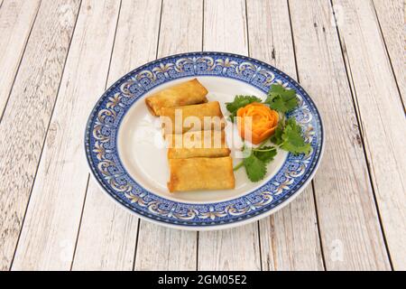 Peking rolls of fried crunchy dough stuffed with stewed duck and vegetables Stock Photo